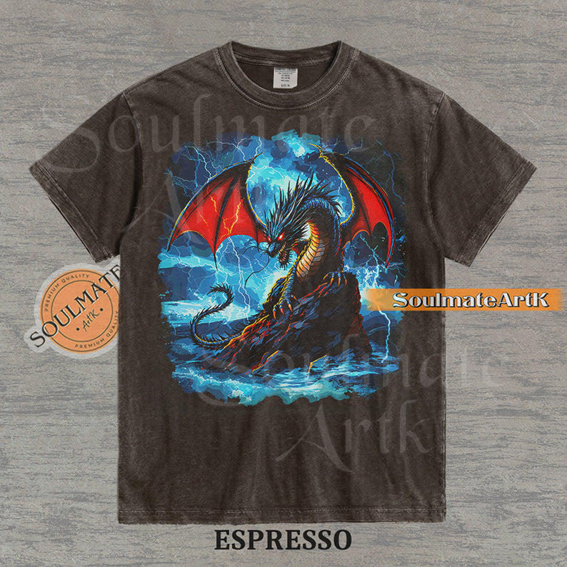 Vintage-style fantasy graphic of a black dragon with red wings perched on a rock amidst blue lightning and ocean waves on a washed espresso t-shirt.