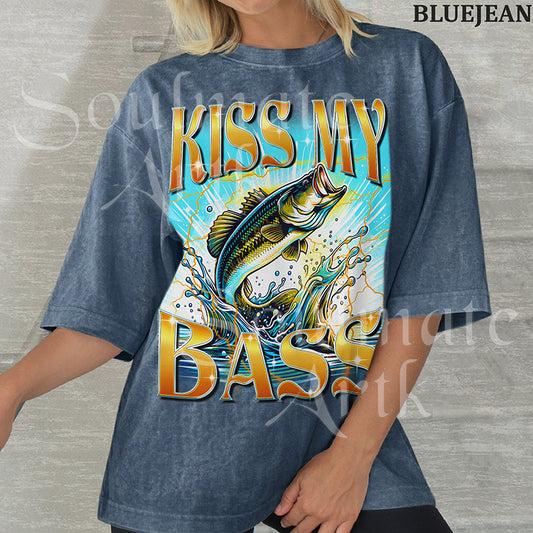 Graphic of a bass fish leaping out of water with golden lightning and bold text reading KISS MY BASS on a washed bluejean shirt.