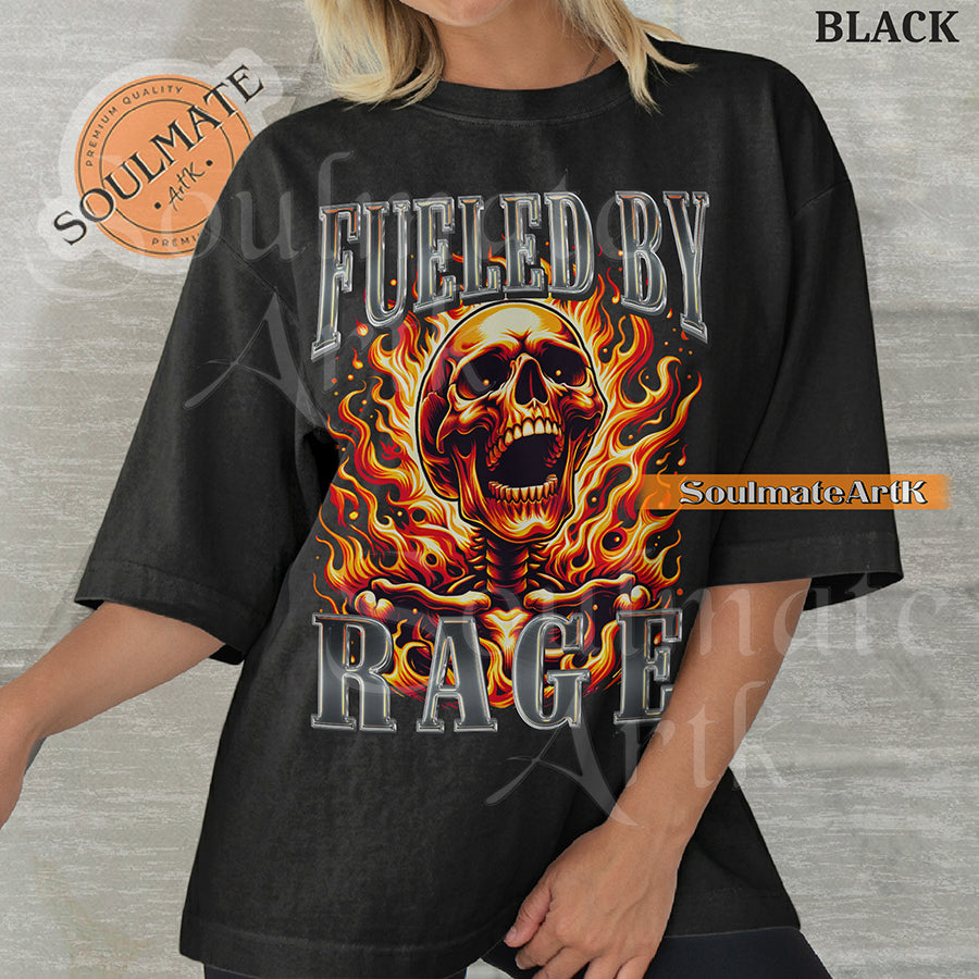 Graphic of a screaming skull engulfed in orange flames with bold chrome 3D text reading FUELED BY RAGE on a washed black shirt.