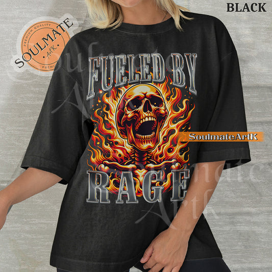 Graphic of a screaming skull engulfed in orange flames with bold chrome 3D text reading FUELED BY RAGE on a washed black shirt.