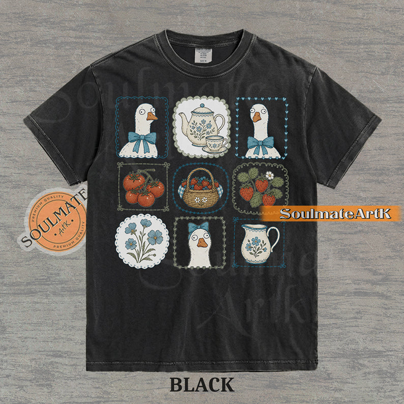 Cottagecore grid illustration featuring geese with bows, strawberries, tomatoes, and vintage teapots on a washed black t-shirt.
