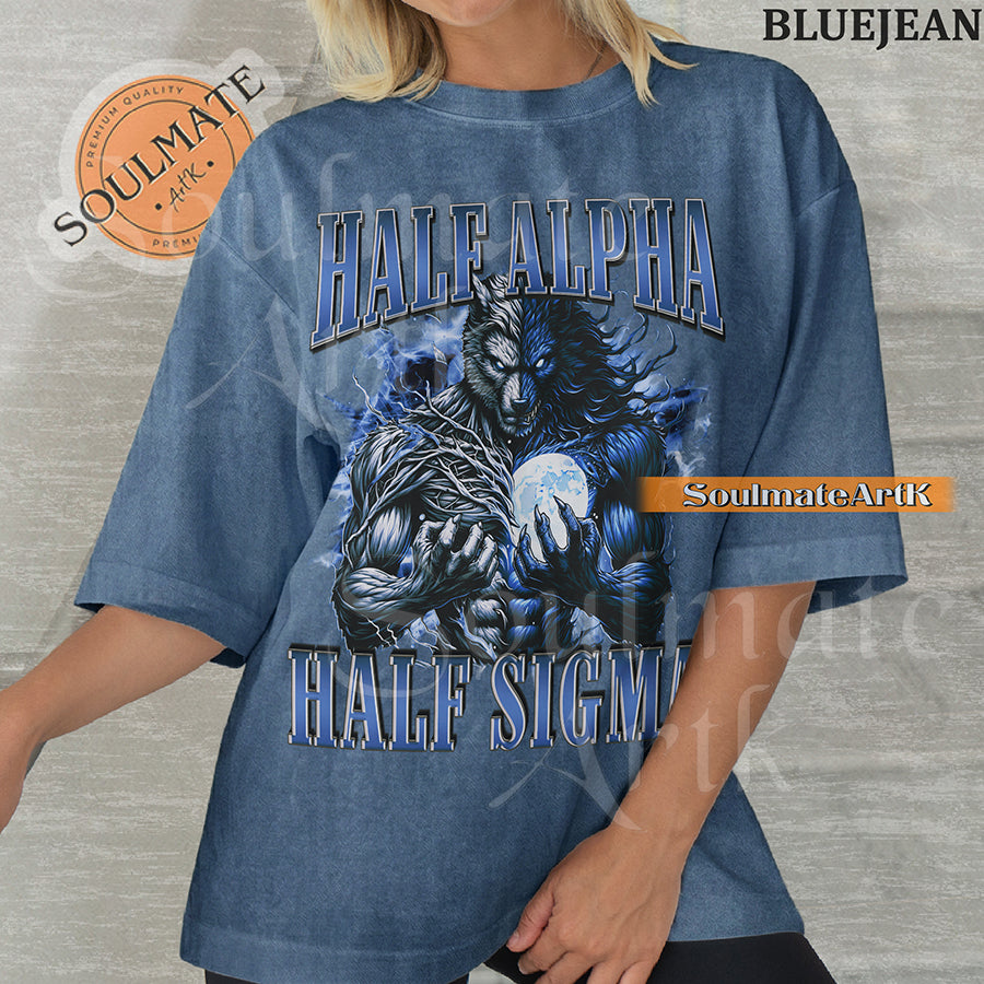 Graphic of a dual-toned werewolf holding a moon with electric blue energy and bold text reading HALF ALPHA HALF SIGMA on a washed bluejean shirt.