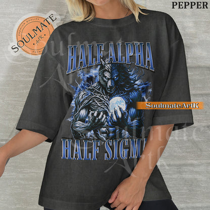Graphic of a dual-toned werewolf holding a moon with electric blue energy and bold text reading HALF ALPHA HALF SIGMA on a washed pepper shirt.