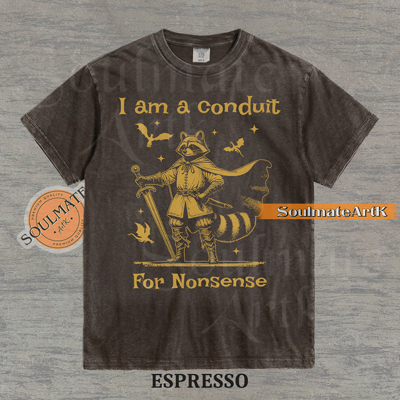 Illustration of a raccoon in knight armor with a cape and sword surrounded by dragons and the text "I am a conduit For Nonsense" on a washed espresso t-shirt.