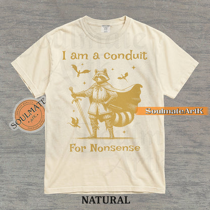 Illustration of a raccoon in knight armor with a cape and sword surrounded by dragons and the text "I am a conduit For Nonsense" on a washed natural t-shirt.