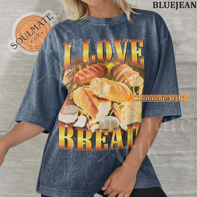 Graphic collage of various types of bread and loaves surrounded by golden lightning with bold gradient text reading I LOVE BREAD on a washed bluejean shirt.