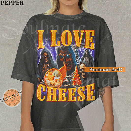 Vintage-style bootleg graphic of a skeleton excitedly holding a large wedge of cheese with the text I Love Cheese in a bold 90s metallic font on a washed t-shirt.