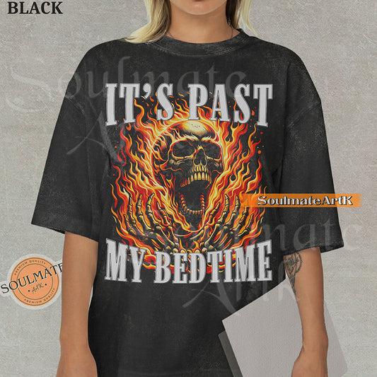 Graphic of a screaming skull in orange flames with bold text reading IT'S PAST MY BEDTIME on a washed black t-shirt.