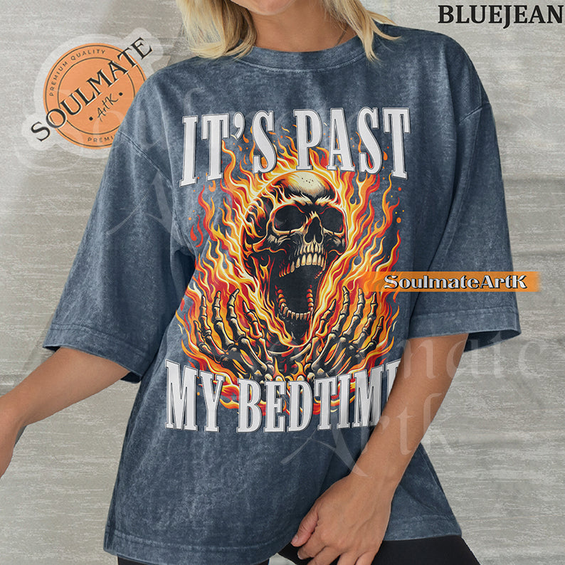 Graphic of a screaming skull in orange flames with bold text reading IT'S PAST MY BEDTIME on a washed bluejean t-shirt.