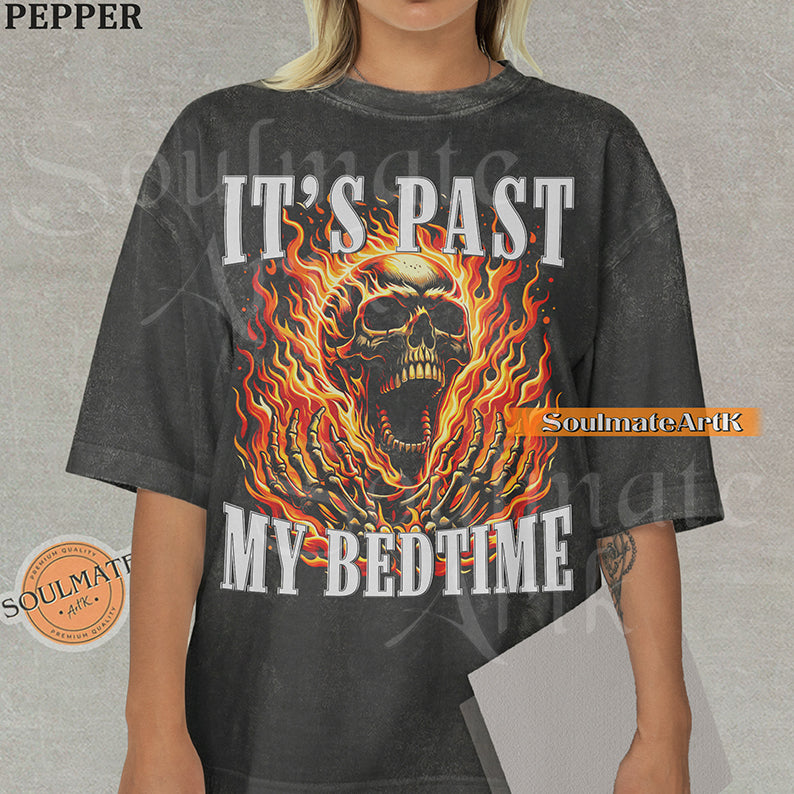 Graphic of a screaming skull in orange flames with bold text reading IT'S PAST MY BEDTIME on a washed pepper t-shirt.