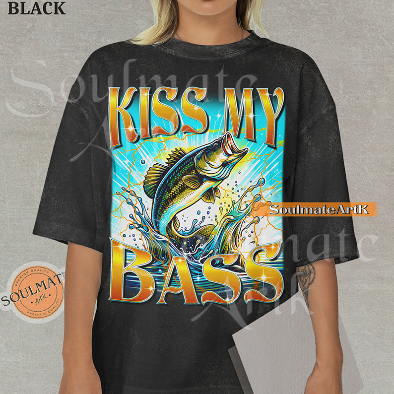 Graphic of a bass fish leaping out of water with golden lightning and bold text reading KISS MY BASS on a washed black shirt.
