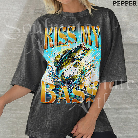 Graphic of a bass fish leaping out of water with golden lightning and bold text reading KISS MY BASS on a washed pepper shirt.