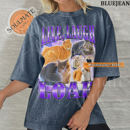 Collage of several cats sitting in loaf positions surrounded by purple lightning with bold purple text reading Live Laugh Loaf on a bluejean shirt.