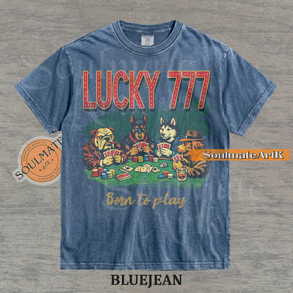 Retro-style illustration of four dogs playing poker under bold "LUCKY 777" text on a washed bluejean shirt.