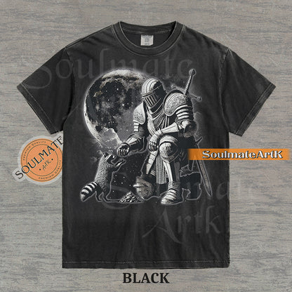 Detailed illustration of a kneeling medieval knight petting a raccoon in front of a giant moon on a washed black shirt.