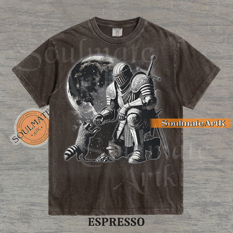 Detailed illustration of a kneeling medieval knight petting a raccoon in front of a giant moon on a washed espresso shirt.