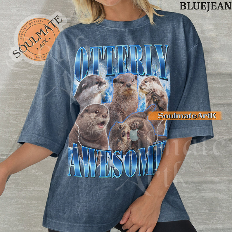 Collage of multiple otters in various poses surrounded by blue lightning with bold blue text reading Otterly Awesome on a bluejean shirt.