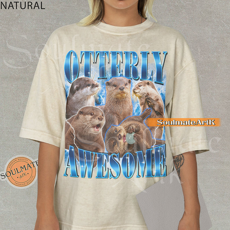 Collage of multiple otters in various poses surrounded by blue lightning with bold blue text reading Otterly Awesome on a natural shirt.