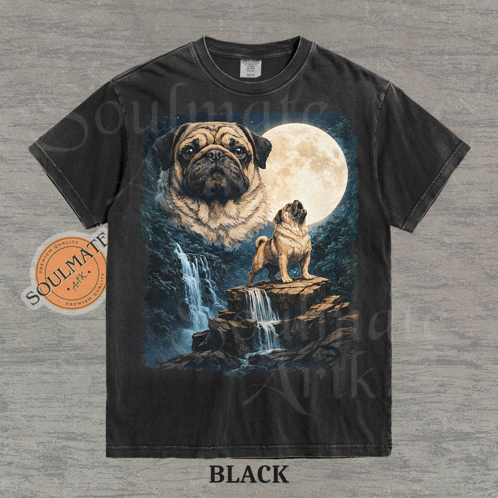 Graphic of pugs in a moonlit mountain landscape with a waterfall on a washed black shirt.