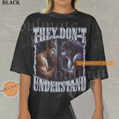 Cinematic graphic of a shirtless man and a wolf facing each other through a window with bold silver text reading They Don't Understand on a washed black shirt.