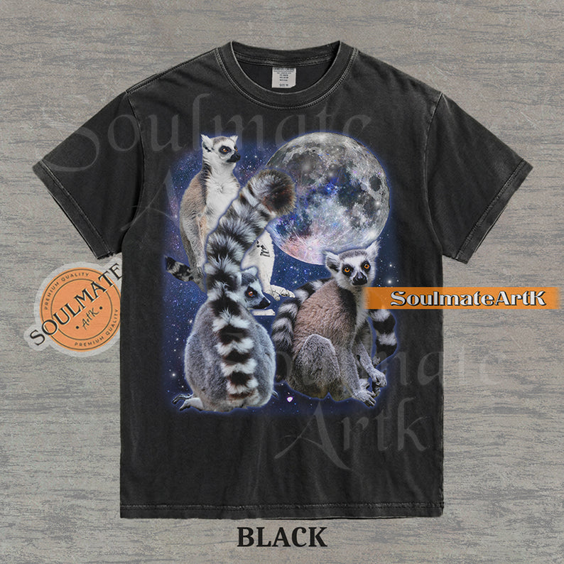Collage of ring-tailed lemurs in various poses in front of a glowing full moon and a starry nebula on a washed black shirt.