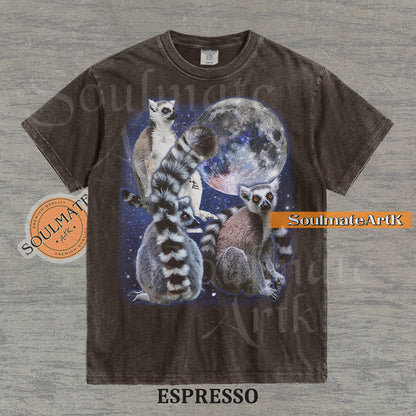 Collage of ring-tailed lemurs in various poses in front of a glowing full moon and a starry nebula on a washed espresso shirt.