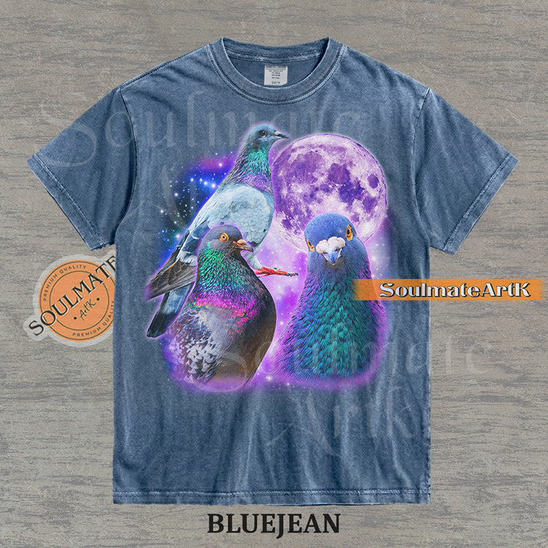 Collage of three pigeons with iridescent feathers in front of a glowing purple moon and a starry nebula on a washed bluejean shirt.