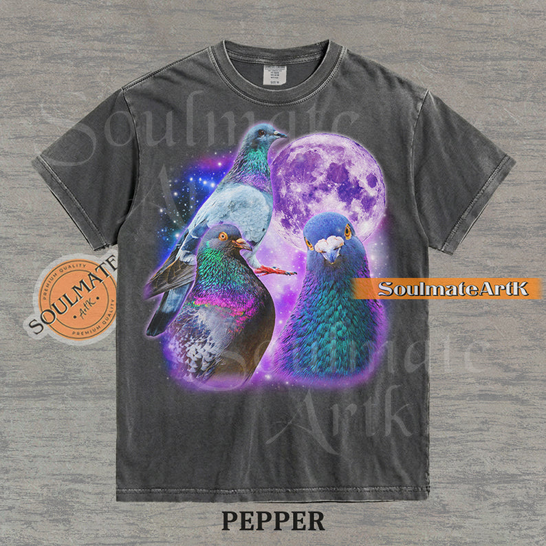 Collage of three pigeons with iridescent feathers in front of a glowing purple moon and a starry nebula on a washed pepper shirt.
