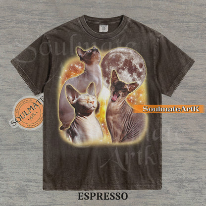 Collage of three Sphynx cats in front of a glowing moon and a golden starry nebula on a washed espresso shirt.
