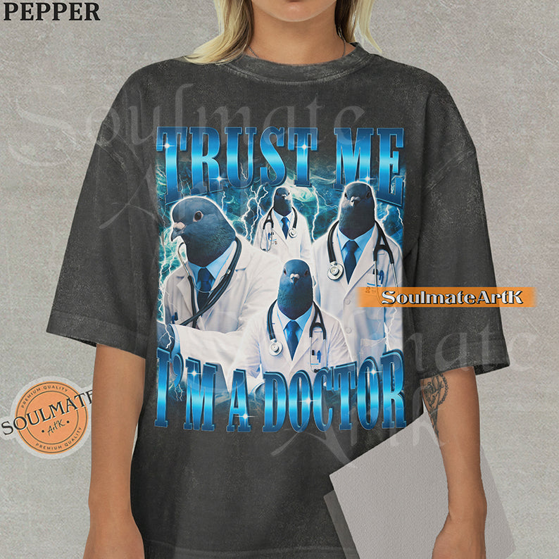 Collage of pigeons in doctor coats and stethoscopes with blue lightning and bold blue text reading Trust Me I'm A Doctor on a washed pepper shirt.