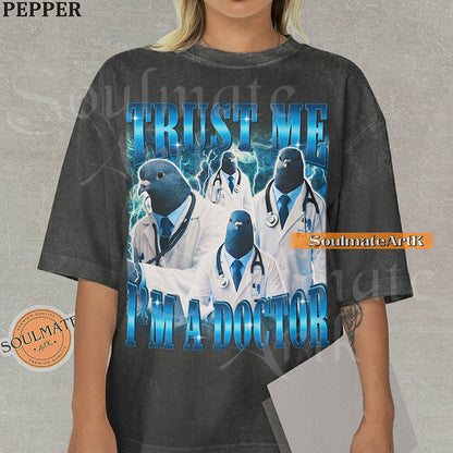 Collage of pigeons in doctor coats and stethoscopes with blue lightning and bold blue text reading Trust Me I'm A Doctor on a washed pepper shirt.