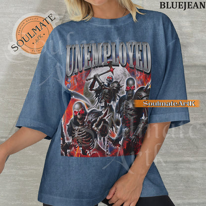 Graphic collage of armored skeletons with red eyes and weapons surrounded by flames and a moon with bold chrome text reading UNEMPLOYED on a washed bluejean shirt.