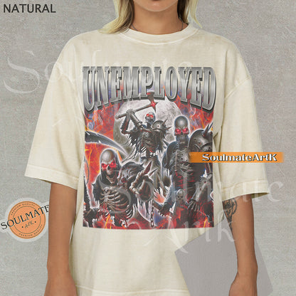 Graphic collage of armored skeletons with red eyes and weapons surrounded by flames and a moon with bold chrome text reading UNEMPLOYED on a natural shirt.