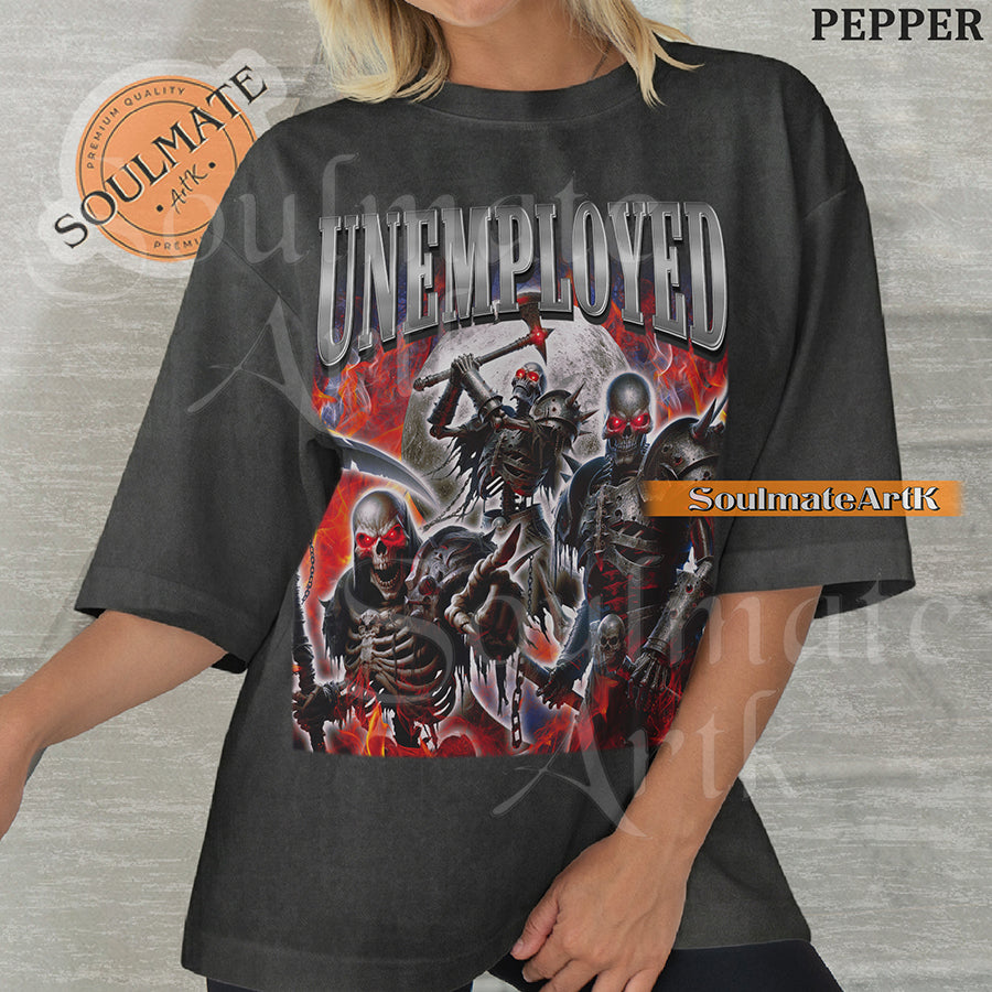 Graphic collage of armored skeletons with red eyes and weapons surrounded by flames and a moon with bold chrome text reading UNEMPLOYED on a washed pepper shirt.