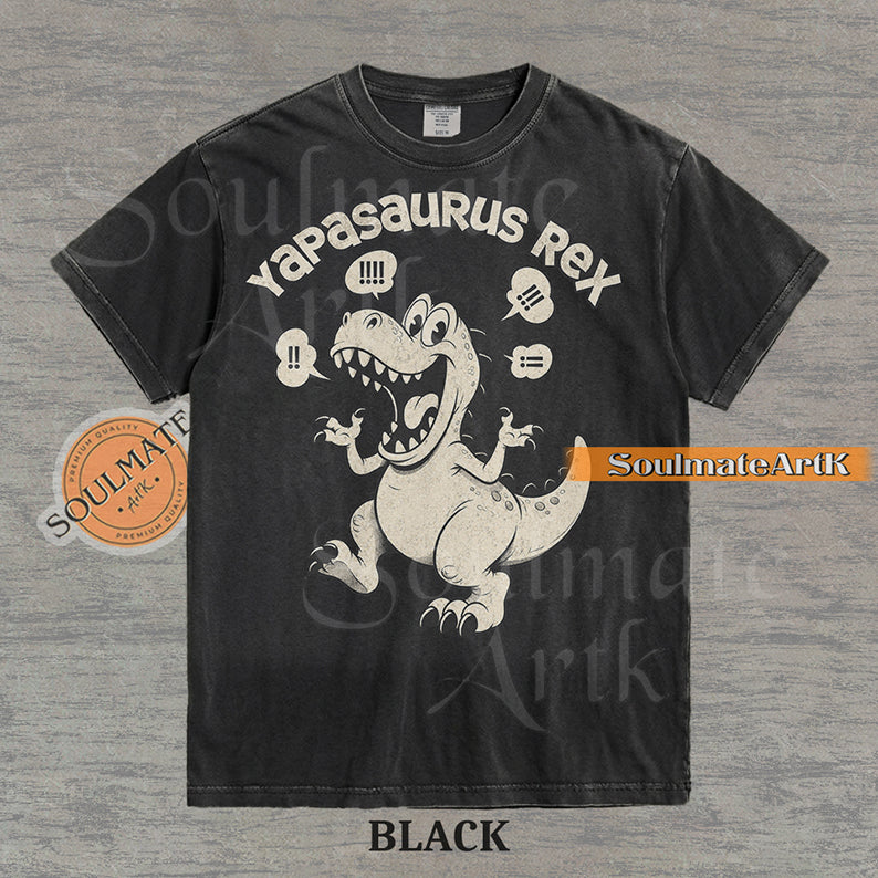 A funny t-shirt featuring a T-Rex dinosaur with the text "Yapasaurus Rex." A hilarious meme graphic for people who talk too much, in a vintage-style illustration.