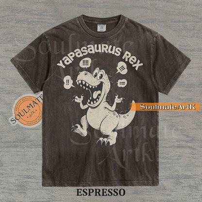 A funny t-shirt featuring a T-Rex dinosaur with the text "Yapasaurus Rex." A hilarious meme graphic for people who talk too much, in a vintage-style illustration.