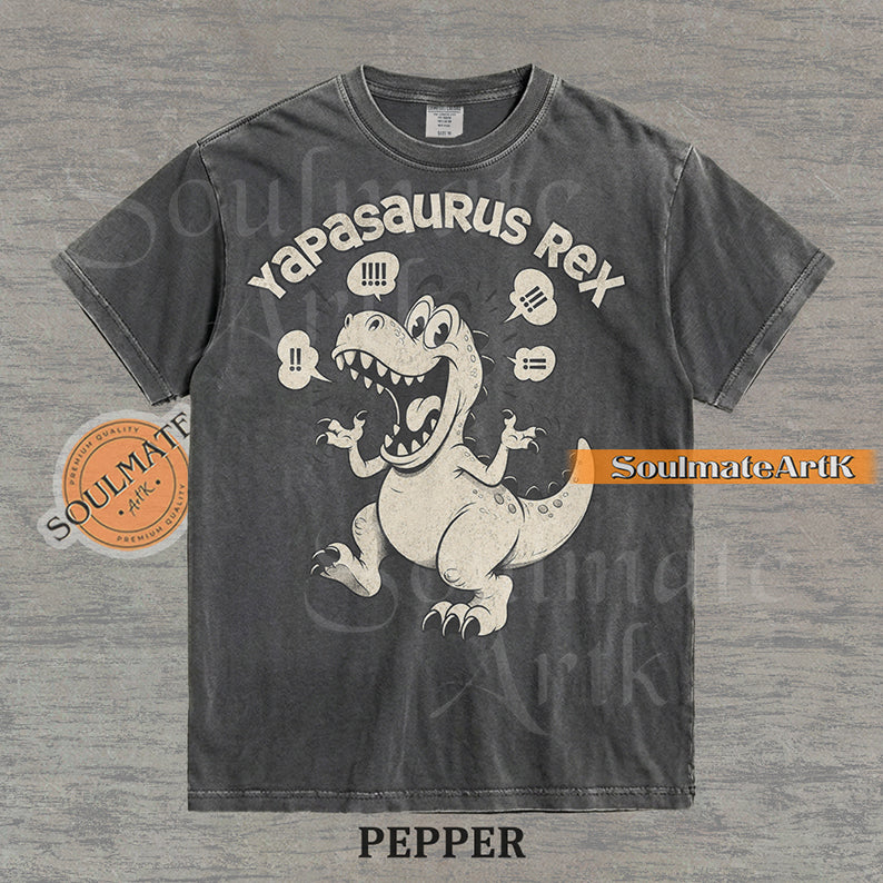 A funny t-shirt featuring a T-Rex dinosaur with the text "Yapasaurus Rex." A hilarious meme graphic for people who talk too much, in a vintage-style illustration.